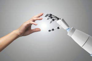 KI Hand Roboter und Mensch ©Canva